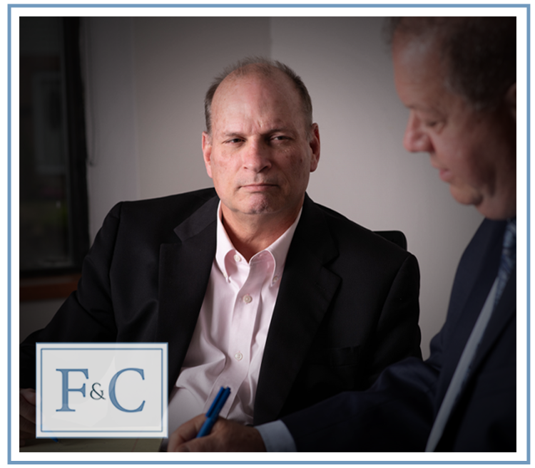 Friday & Cox attorneys Brian Cox and Pete Friday meeting in their Pittsburgh office